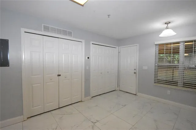 a view of lot of window in an empty room