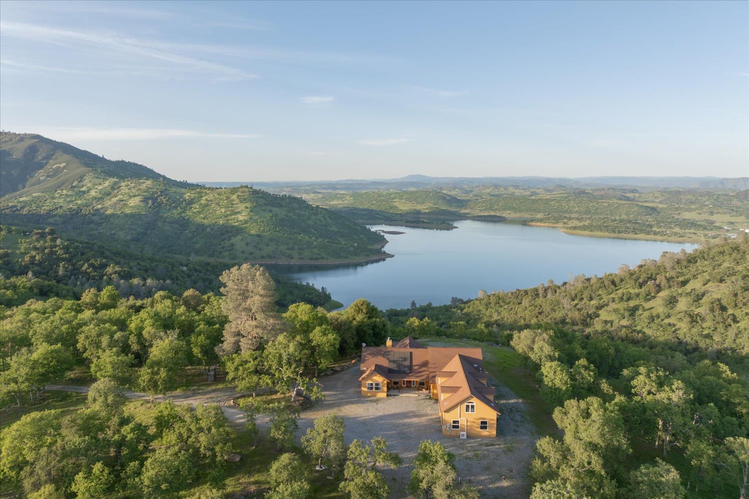 6399 Filly Lane Angels Camp, CA 95222 - Photo 1 of 49 a view of a lake with a mountain