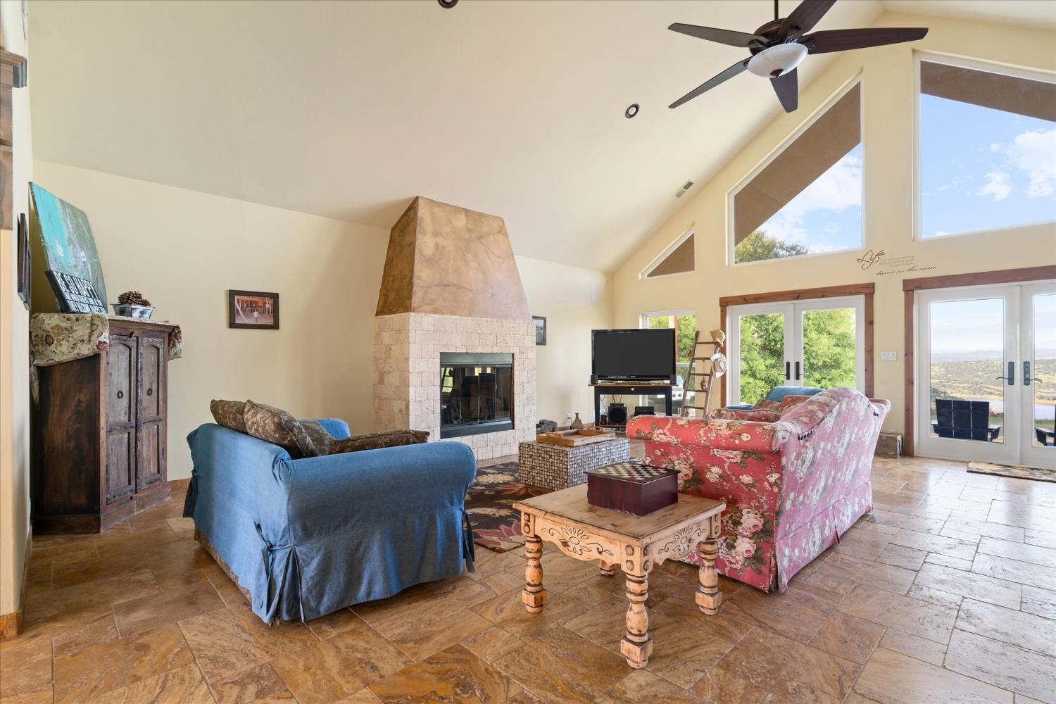6399 Filly Lane Angels Camp, CA 95222 - Photo 11 of 49 a living room with furniture fireplace and a flat screen tv
