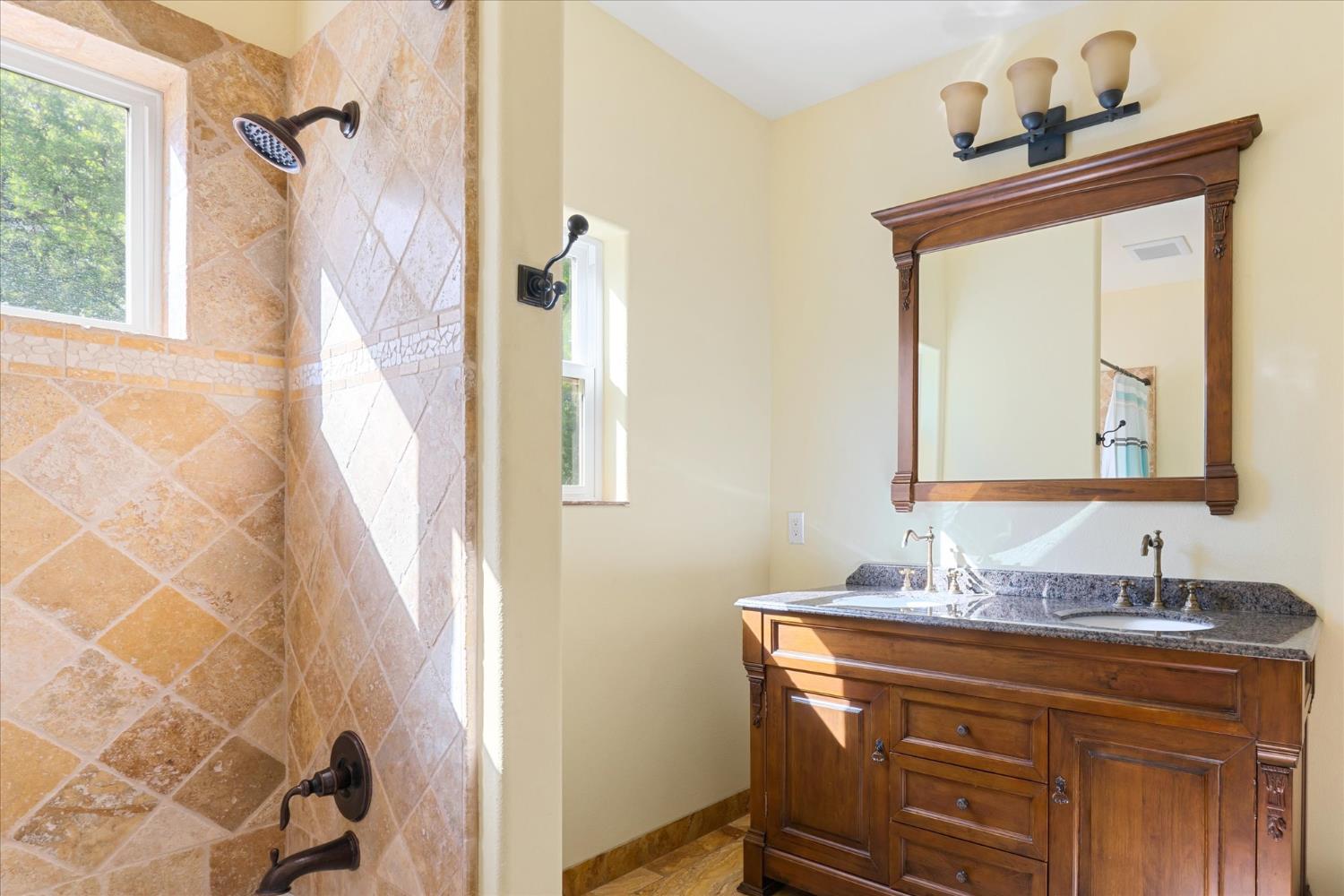 6399 Filly Lane Angels Camp, CA 95222 - Photo 30 of 49 a bathroom with a sink and a mirror