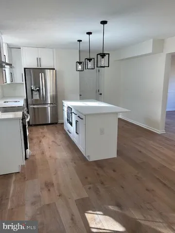 a bathroom with a sink a mirror and shower