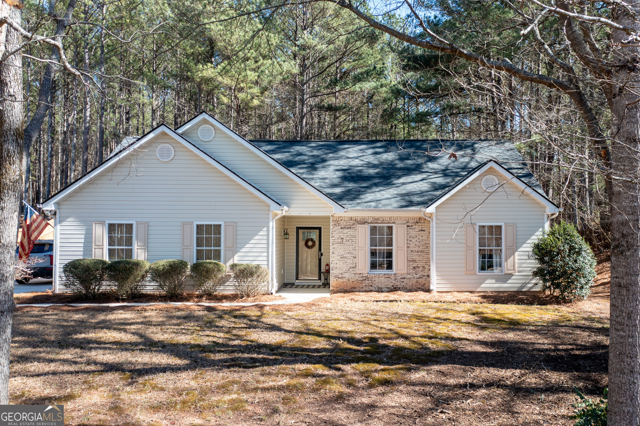 84 Riverside Court Sharpsburg, GA 30277 - Photo 1 of 1 a view of a yard in front of a house with large windows