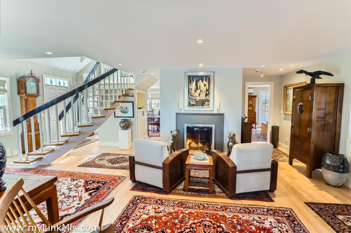 20 Edson Forest Road West Tisbury, MA 02568 - Photo 10 of 47 Gas fire with stairs up and TV room entrance to the right