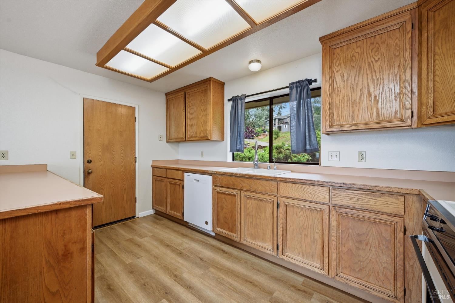 17312 Greenridge Road Hidden Valley Lake, CA 95467 - Photo 12 of 34 Garage leads directly into the kitchen.