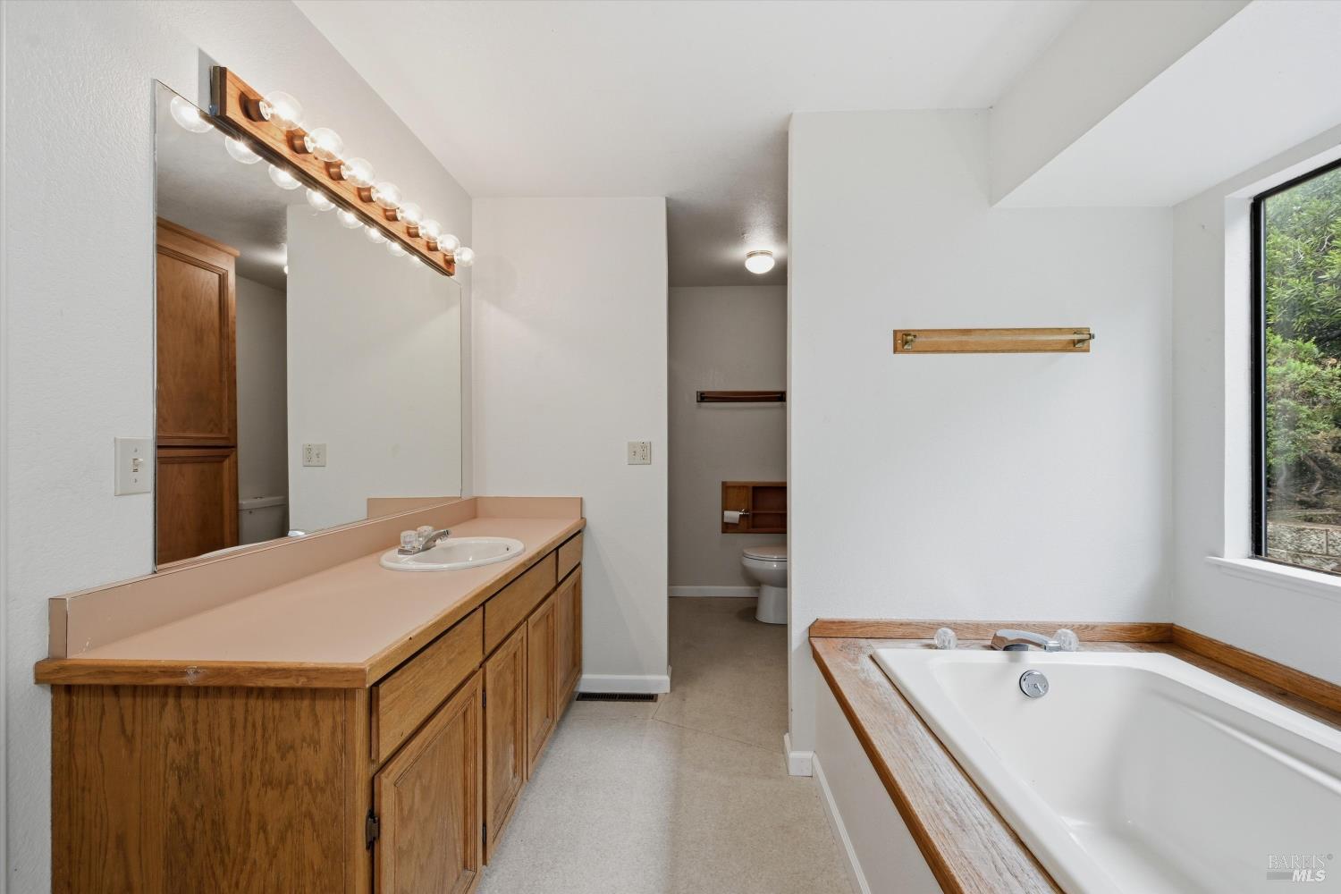 17312 Greenridge Road Hidden Valley Lake, CA 95467 - Photo 20 of 34 Primary bathroom looking toward water closet and shower.