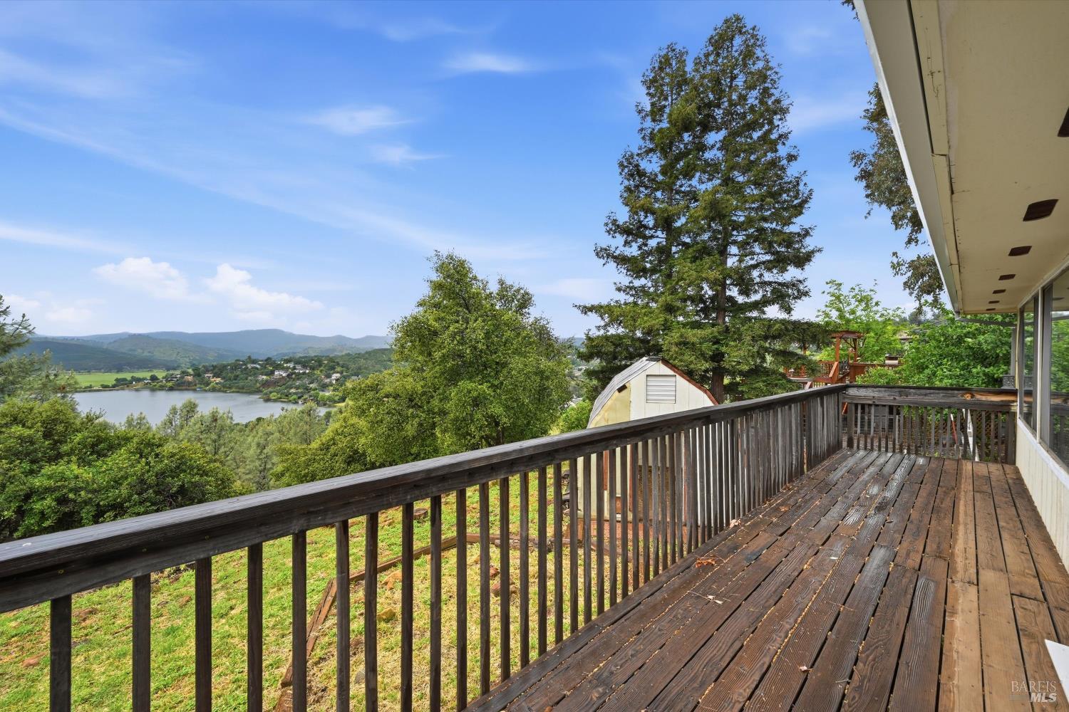 17312 Greenridge Road Hidden Valley Lake, CA 95467 - Photo 26 of 34 Back deck with lake view in the background.