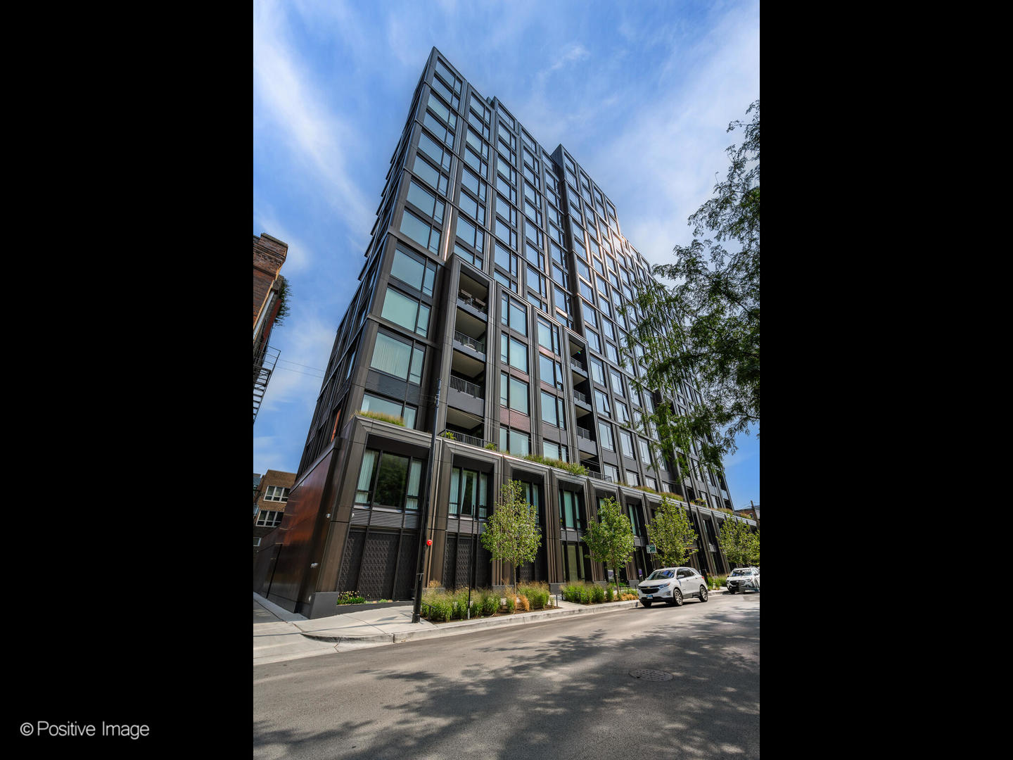 21 North May Street, Unit 505 Chicago, IL 60607 - Photo 1 of 27 a view of a tall building next to a road