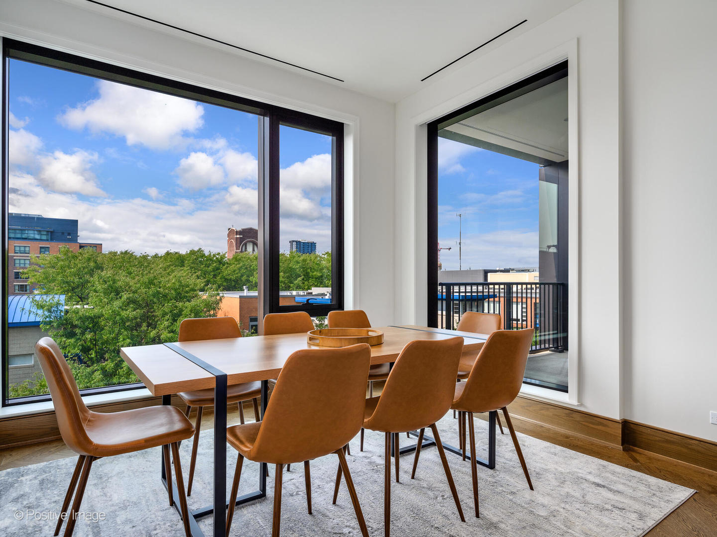 21 North May Street, Unit 505 Chicago, IL 60607 - Photo 15 of 27 a view of a dining room with furniture window and wooden floor
