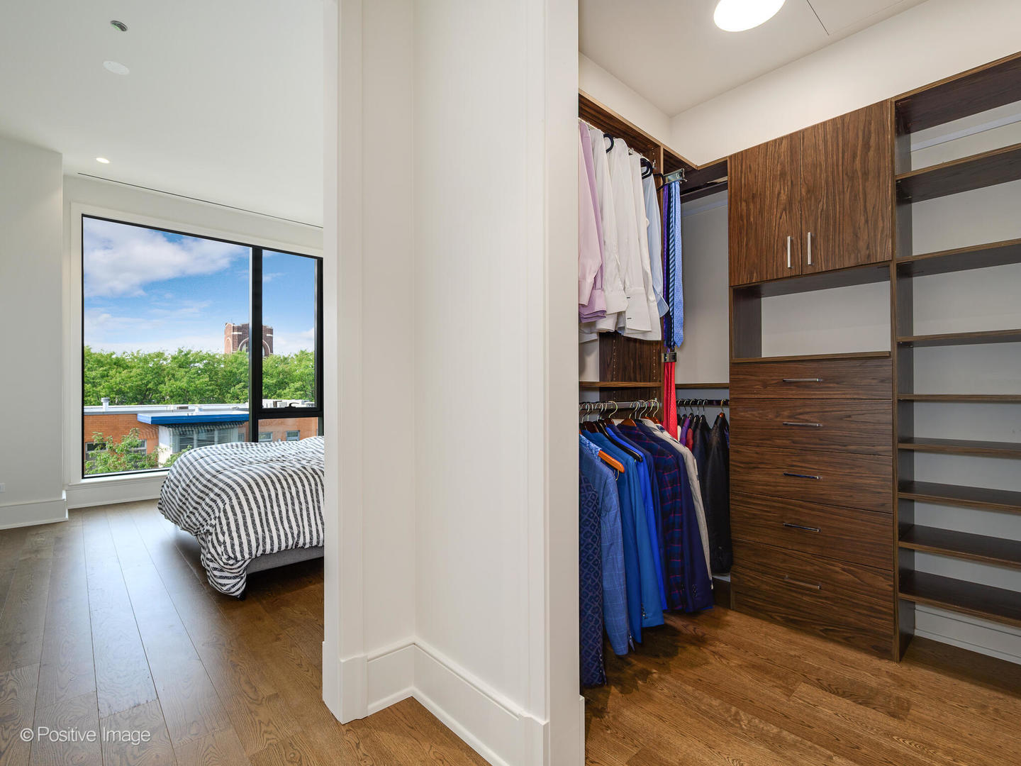 21 North May Street, Unit 505 Chicago, IL 60607 - Photo 18 of 27 a view of hallway with a large window and wooden floor