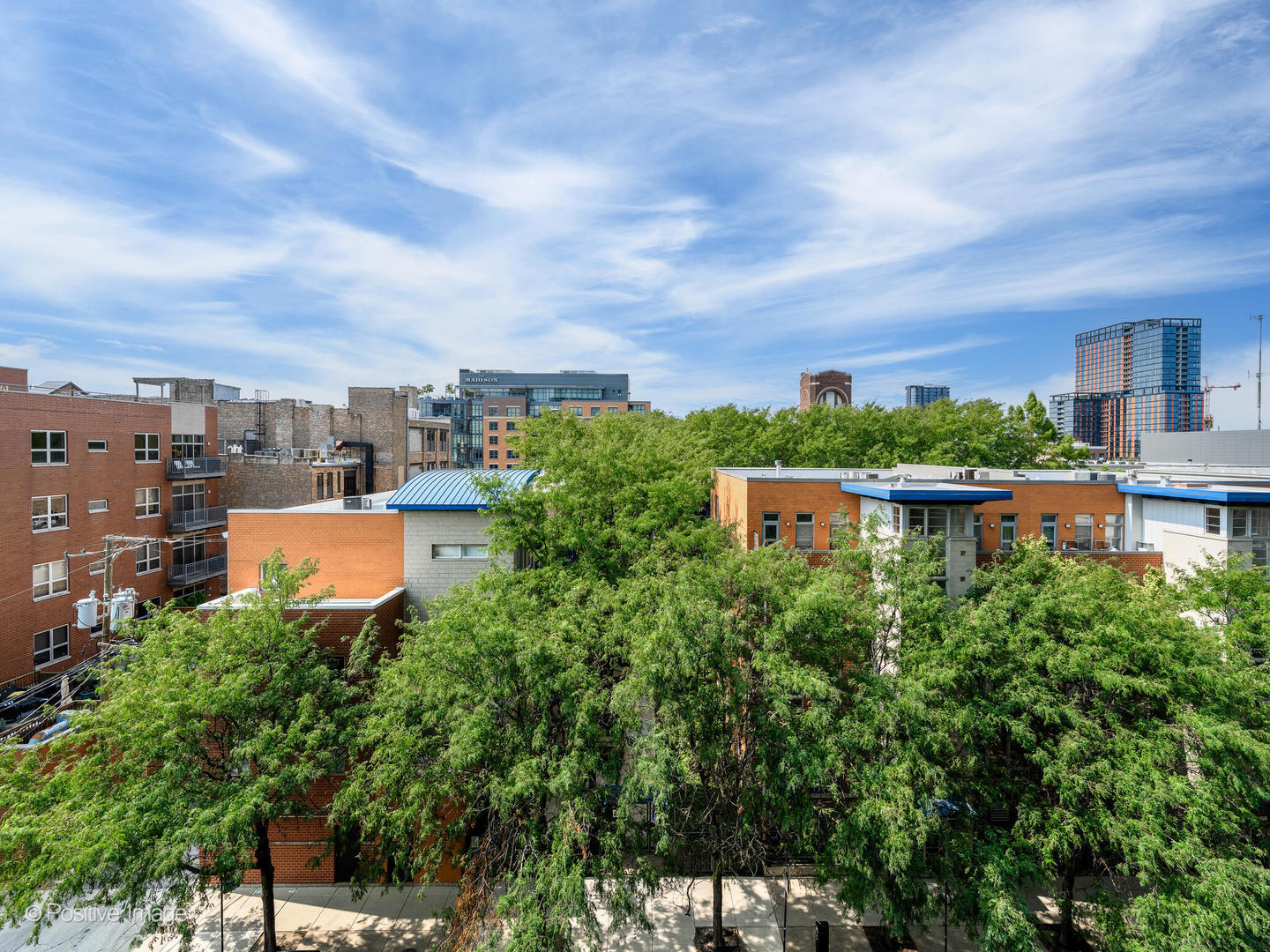 21 North May Street, Unit 505 Chicago, IL 60607 - Photo 27 of 27 a picture of a building with a lot of plants and a barbeque