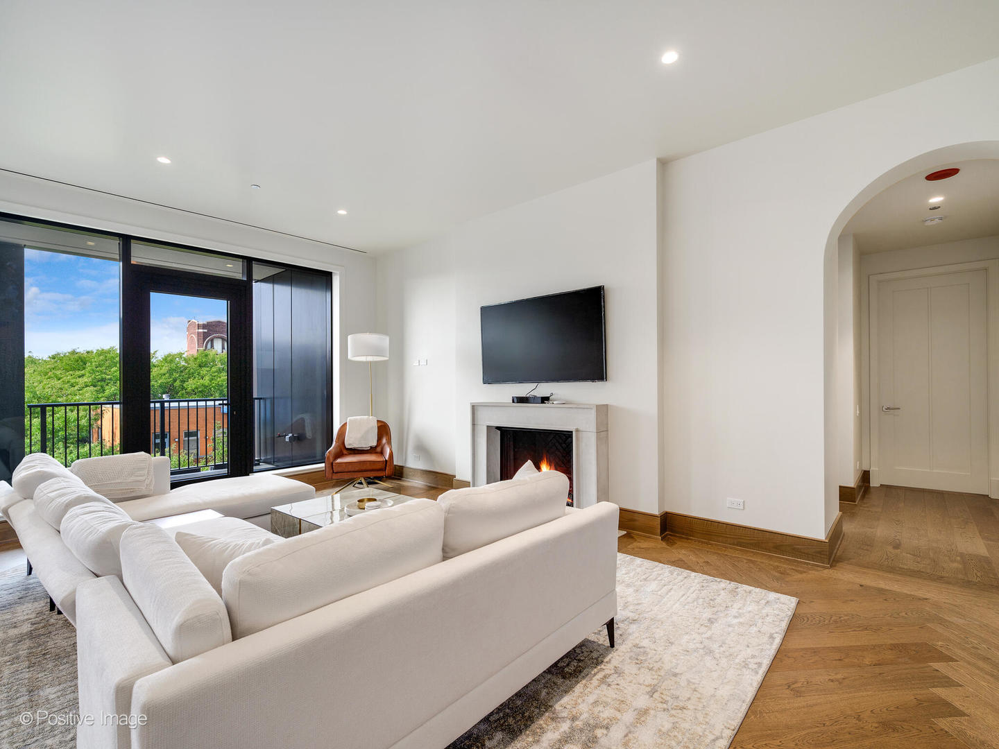 21 North May Street, Unit 505 Chicago, IL 60607 - Photo 5 of 27 a living room with furniture and a flat screen tv