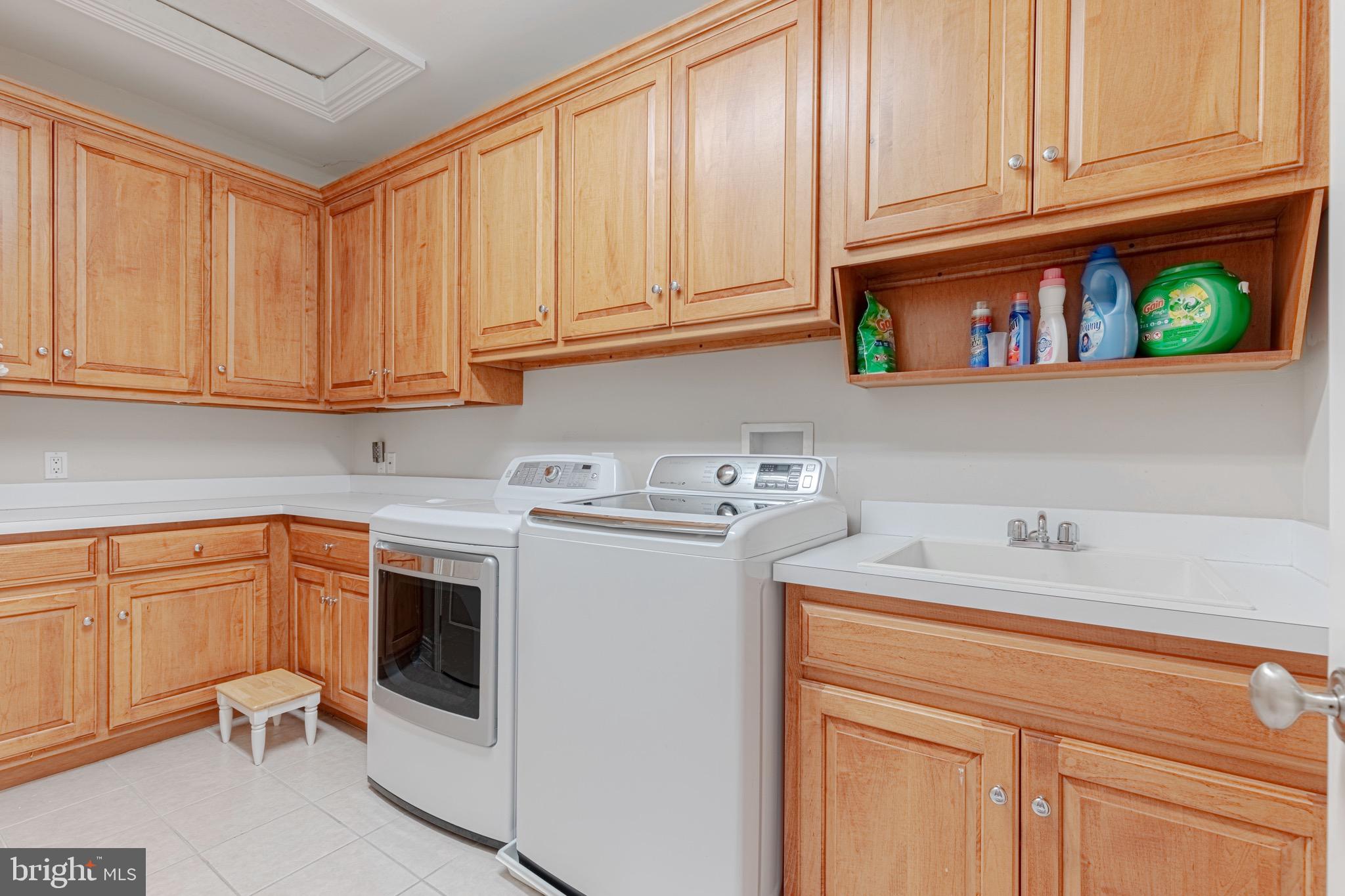 10100 Gary Road Potomac, MD 20854 - Photo 42 of 71 Upper level laundry room w/built-in cabinetry.