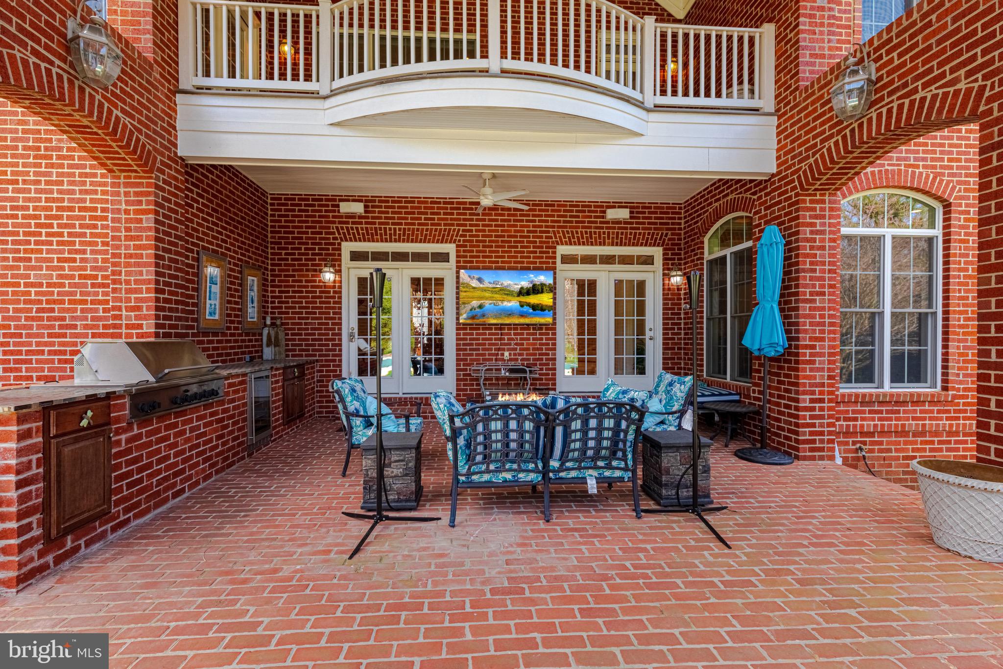 10100 Gary Road Potomac, MD 20854 - Photo 63 of 71 Partially covered back patio w.built-in grill.
