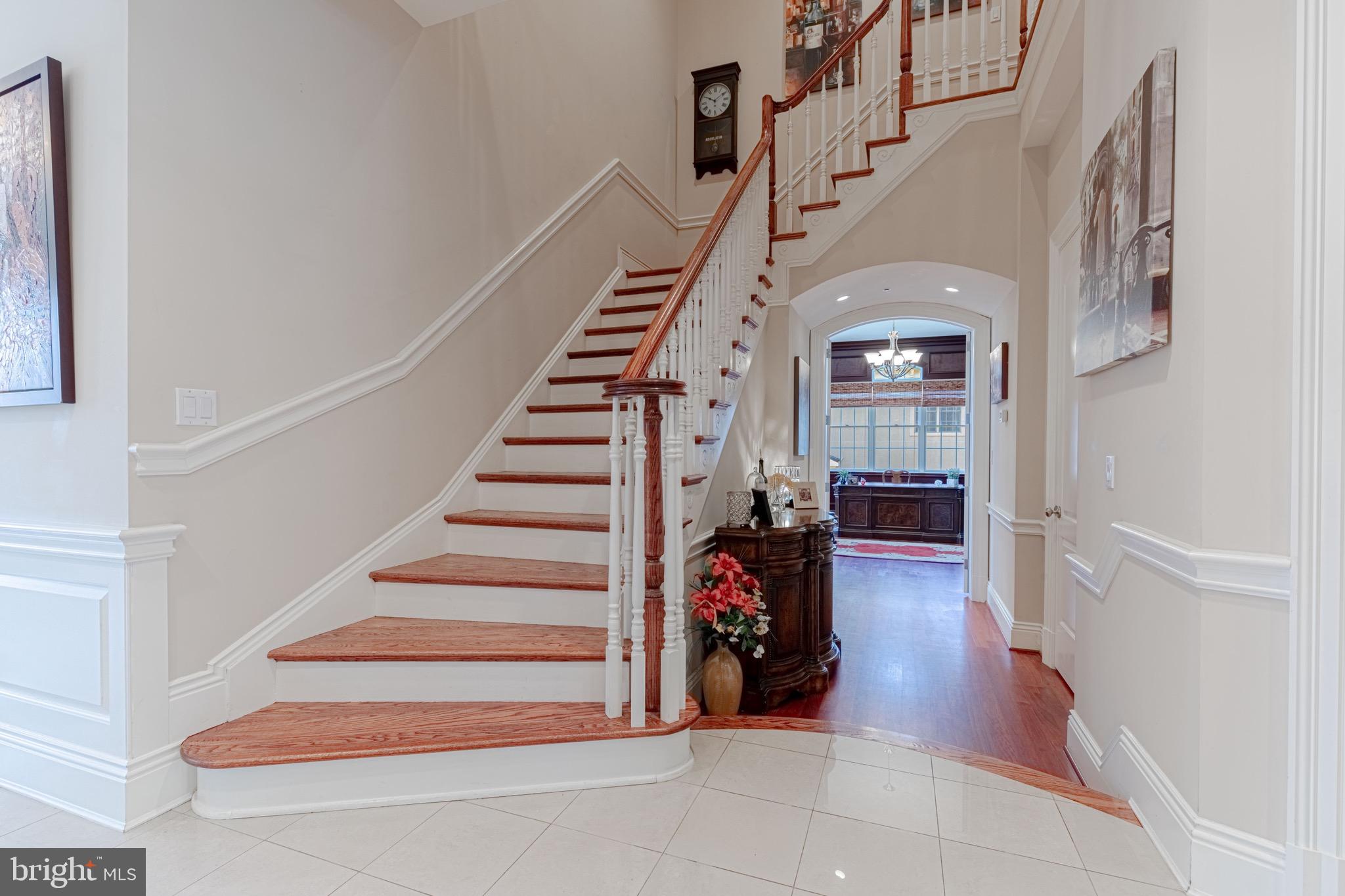 10100 Gary Road Potomac, MD 20854 - Photo 7 of 71 Curved staircase leading to five upper bedrooms.