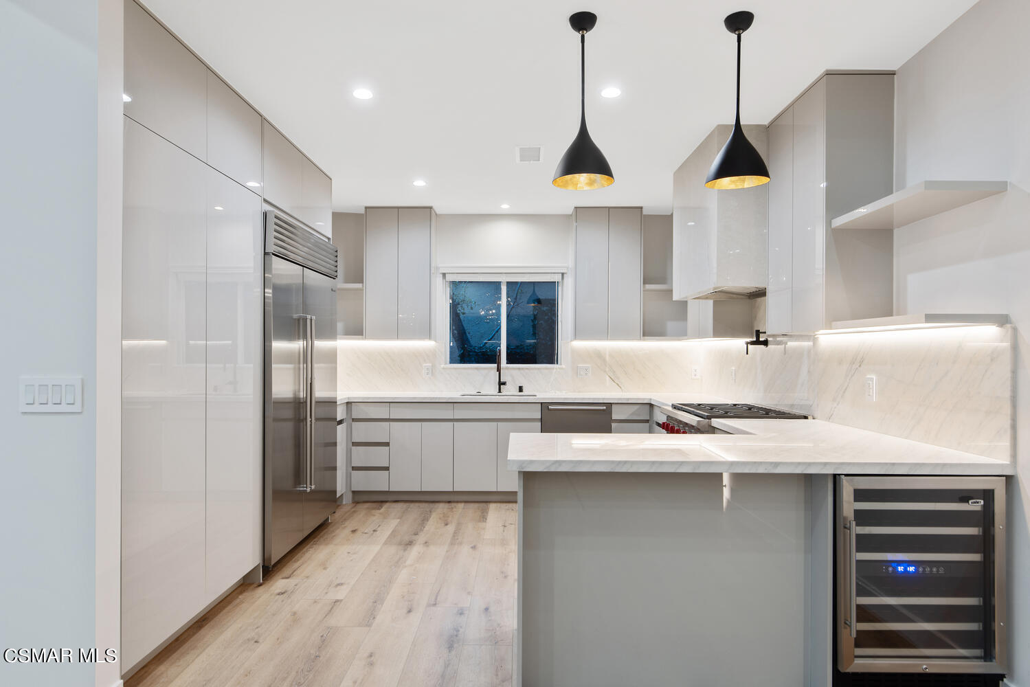 2224 Thorsby Road Lake Sherwood, CA 91361 - Photo 12 of 45 a kitchen with stainless steel appliances granite countertop a sink a stove and a refrigerator