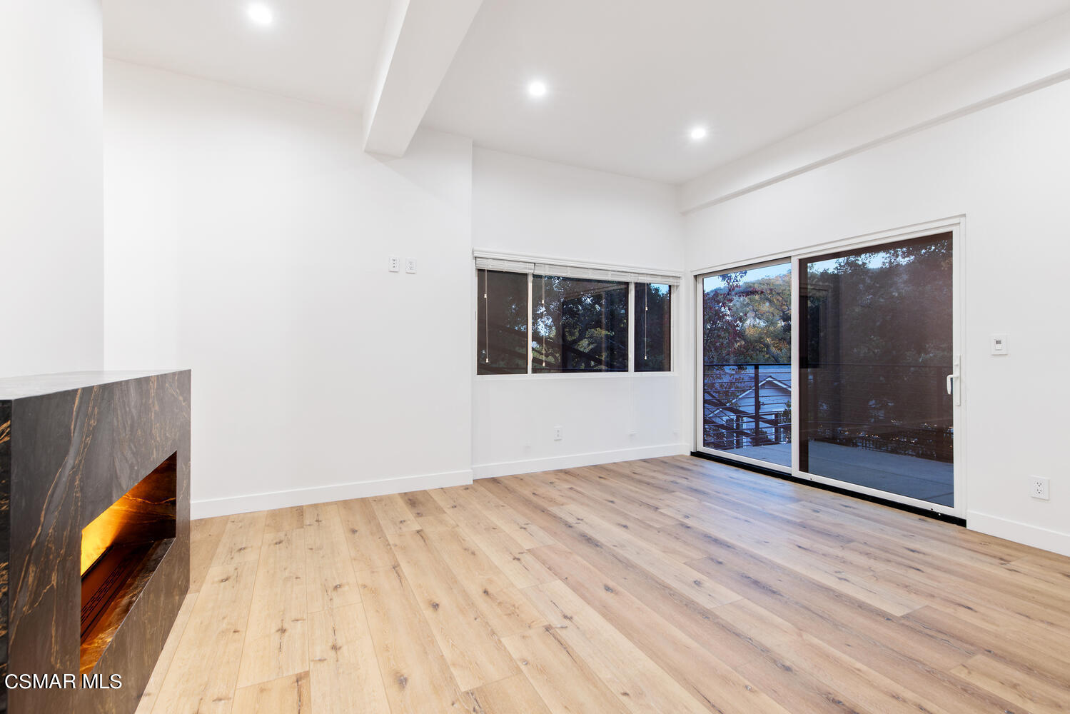 2224 Thorsby Road Lake Sherwood, CA 91361 - Photo 17 of 45 a view of an empty room with a window and wooden floor