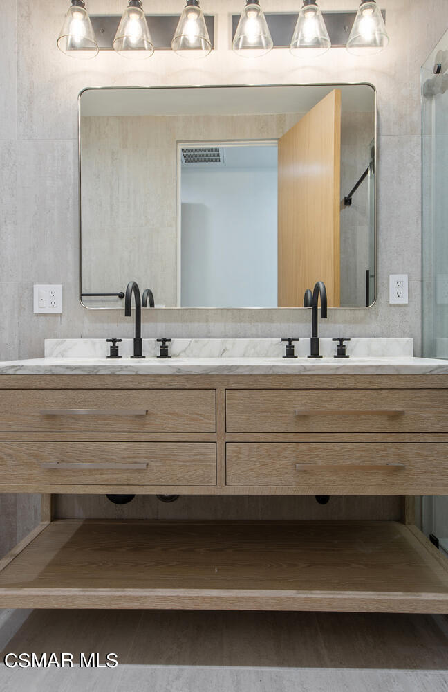 2224 Thorsby Road Lake Sherwood, CA 91361 - Photo 24 of 45 a bathroom with a sink and a mirror