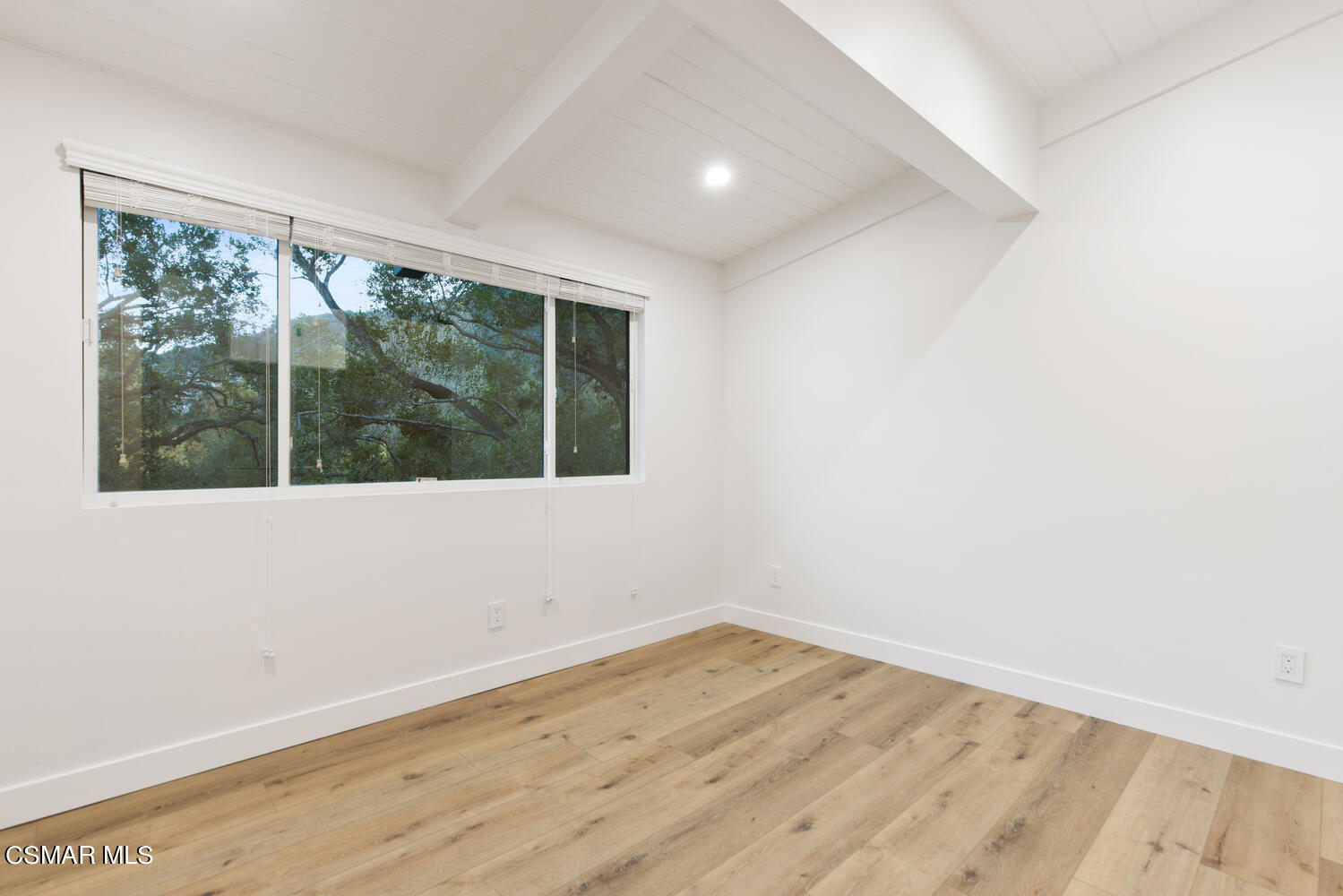 2224 Thorsby Road Lake Sherwood, CA 91361 - Photo 26 of 45 an empty room with wooden floor and windows