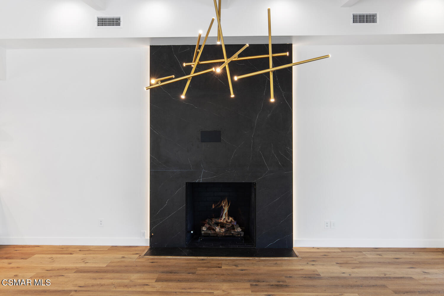 2224 Thorsby Road Lake Sherwood, CA 91361 - Photo 6 of 45 a room with a fireplace and wooden floor