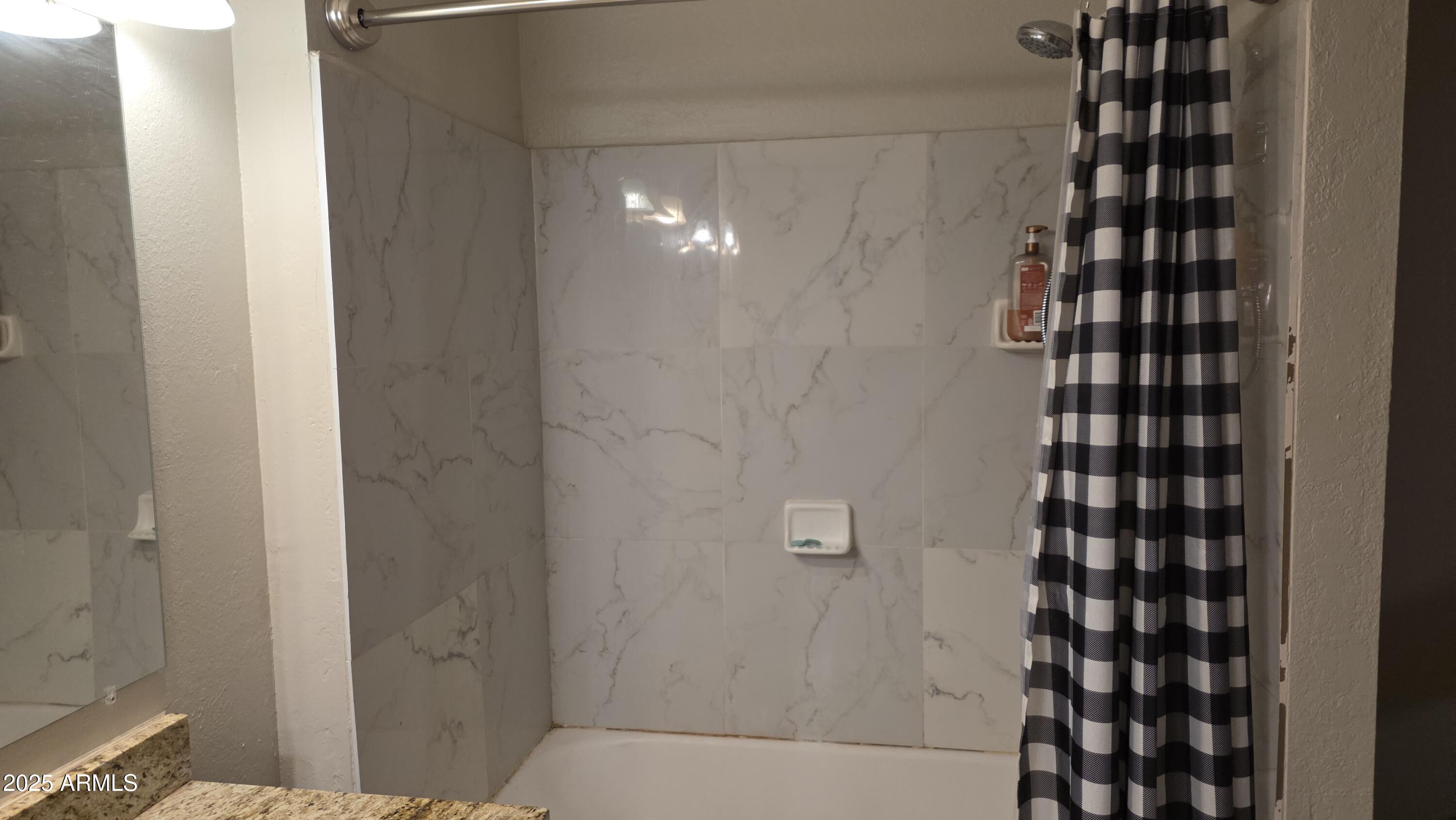 14900 South Capistrano Road Arizona City, AZ 85123 - Photo 12 of 24 a bathroom with a shower