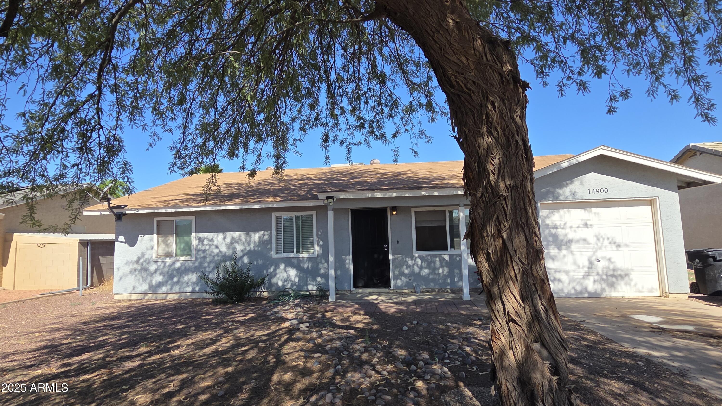 14900 South Capistrano Road Arizona City, AZ 85123 - Photo 14 of 24 a view of a house with a tree in front of it