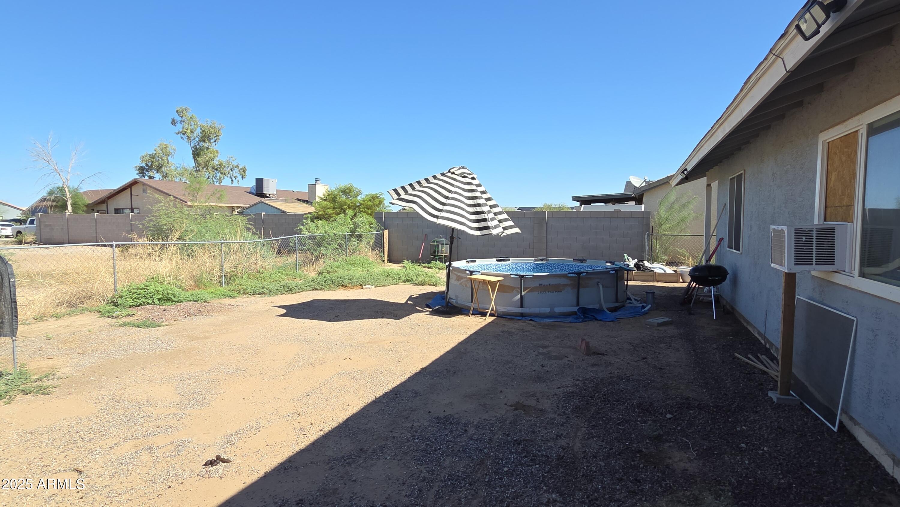 14900 South Capistrano Road Arizona City, AZ 85123 - Photo 15 of 24 a view of a backyard with sitting area