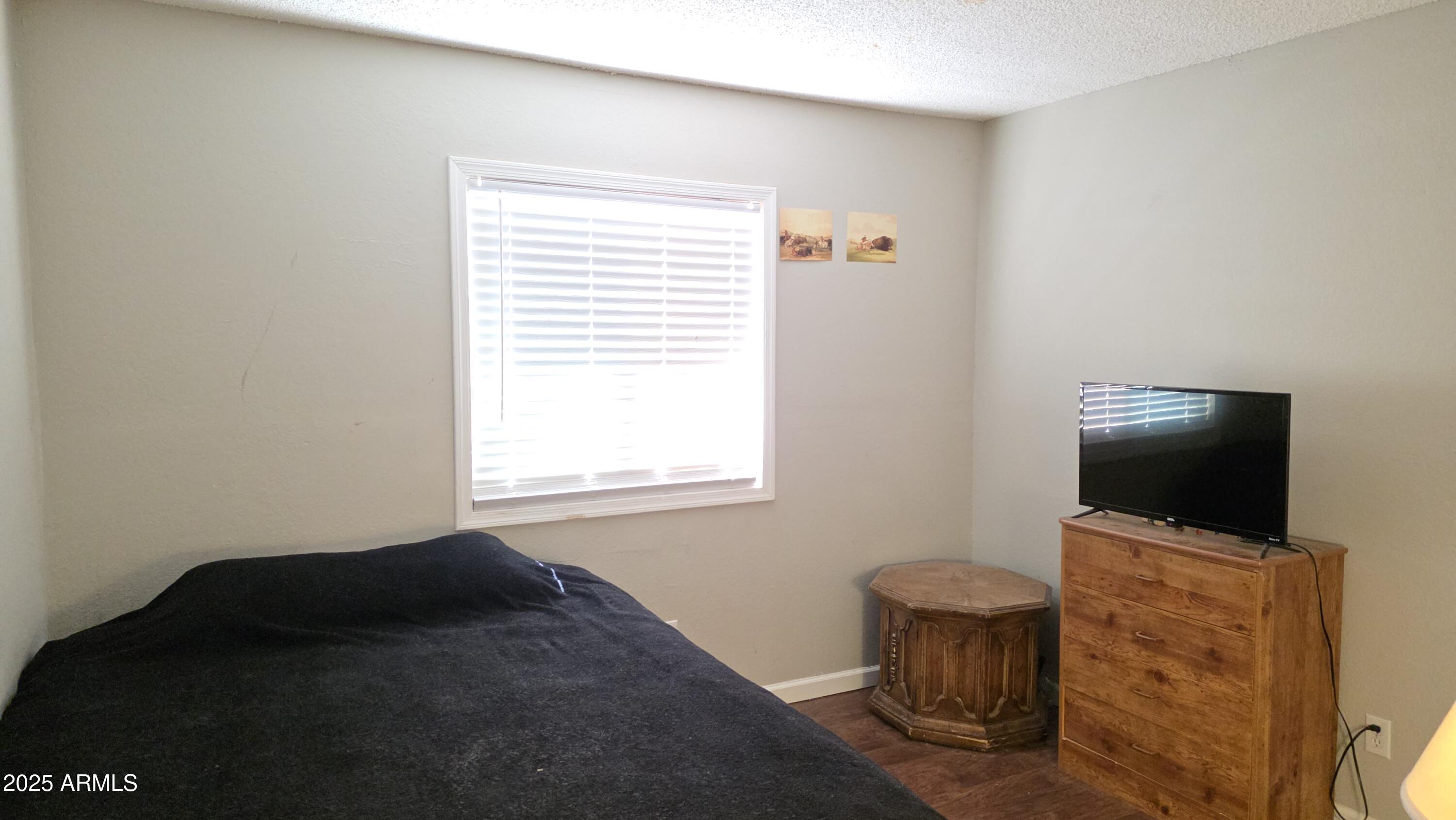 14900 South Capistrano Road Arizona City, AZ 85123 - Photo 19 of 24 a living room with furniture and a flat screen tv