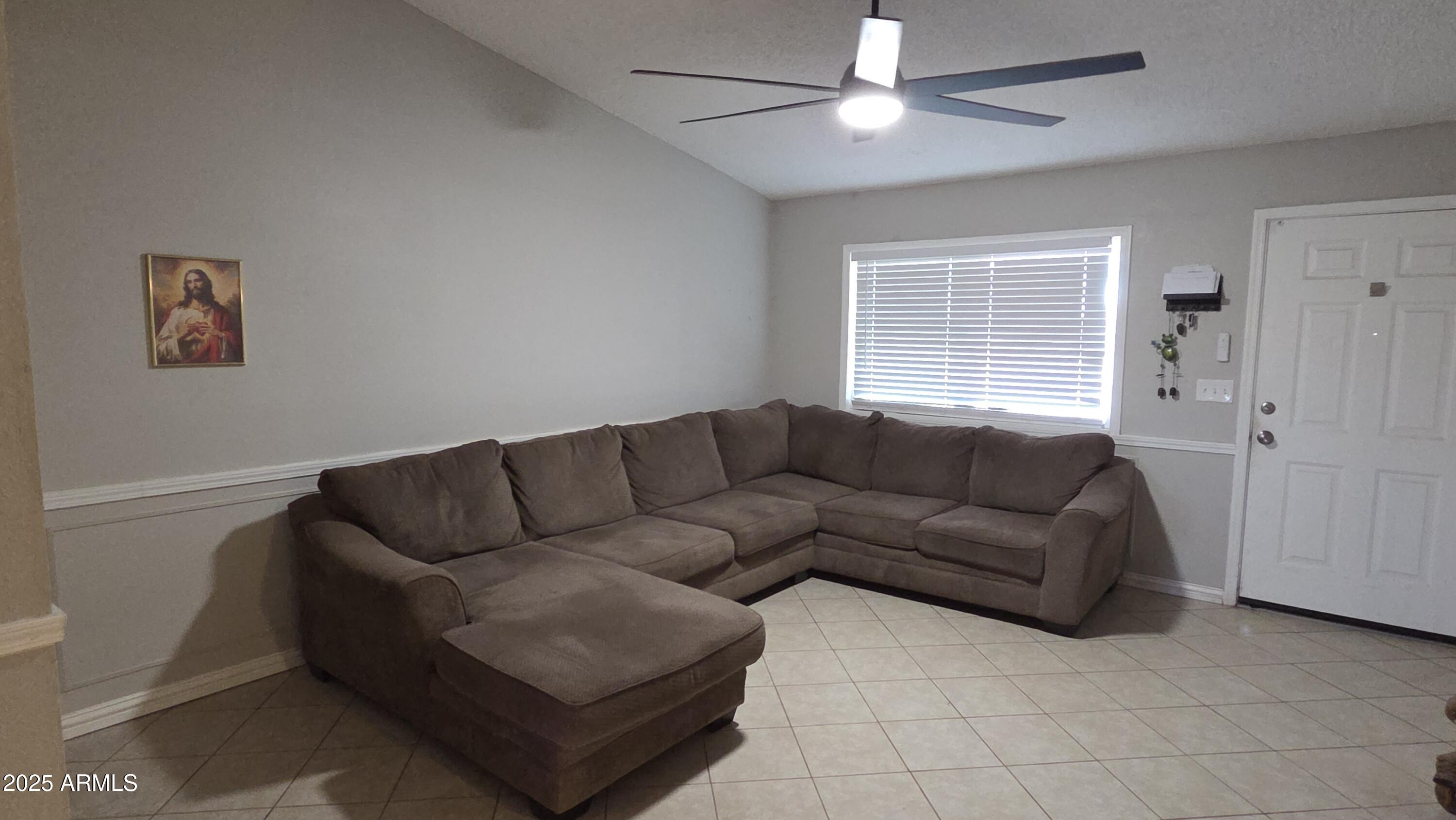 14900 South Capistrano Road Arizona City, AZ 85123 - Photo 2 of 24 a living room with furniture and a window