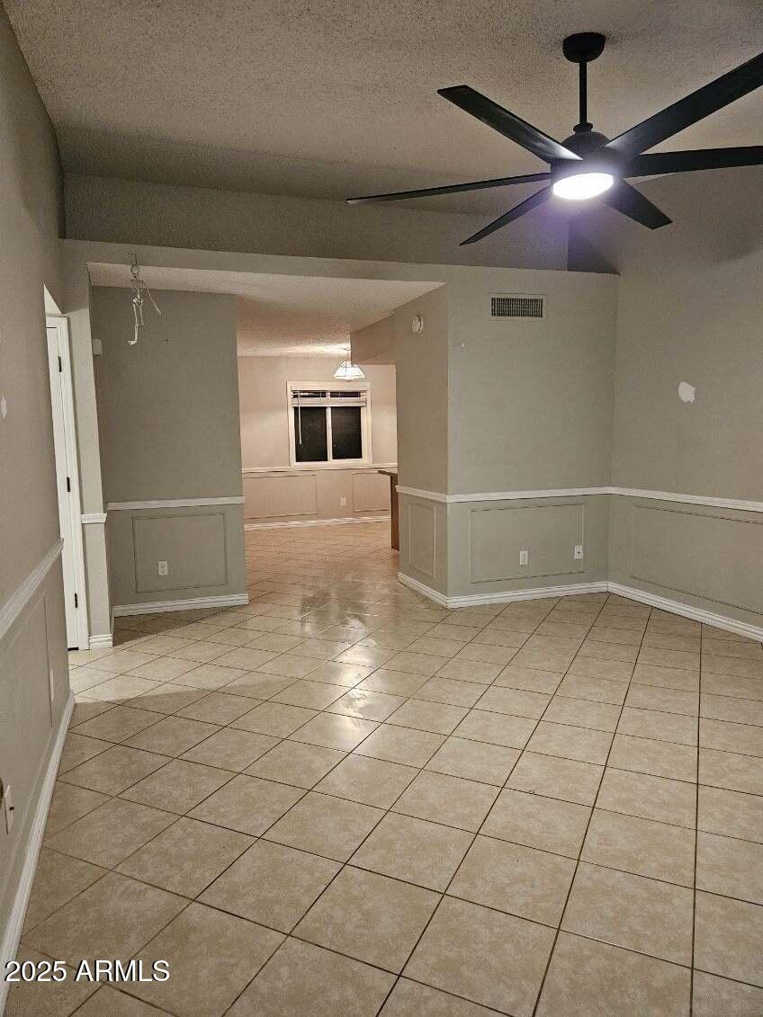 14900 South Capistrano Road Arizona City, AZ 85123 - Photo 23 of 24 a view of a livingroom with a furniture and a ceiling fan
