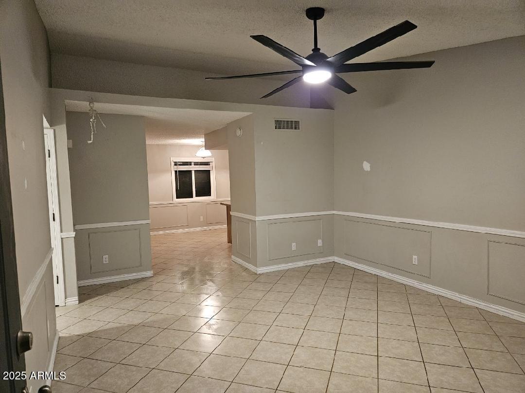 14900 South Capistrano Road Arizona City, AZ 85123 - Photo 24 of 24 a view of a livingroom with a ceiling fan and window