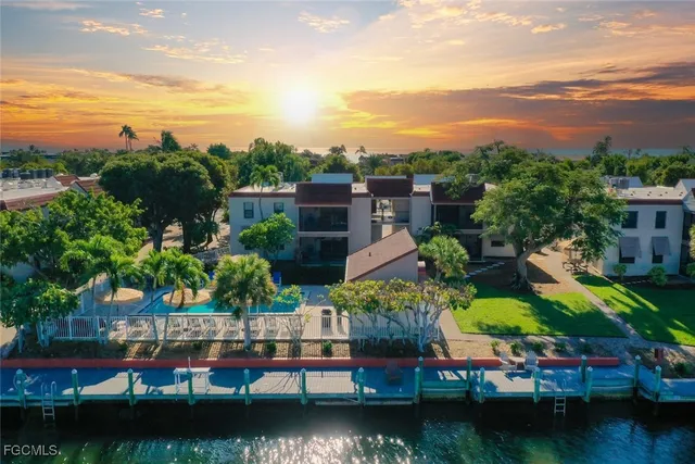 a view of houses with outdoor space swimming pool and ocean view