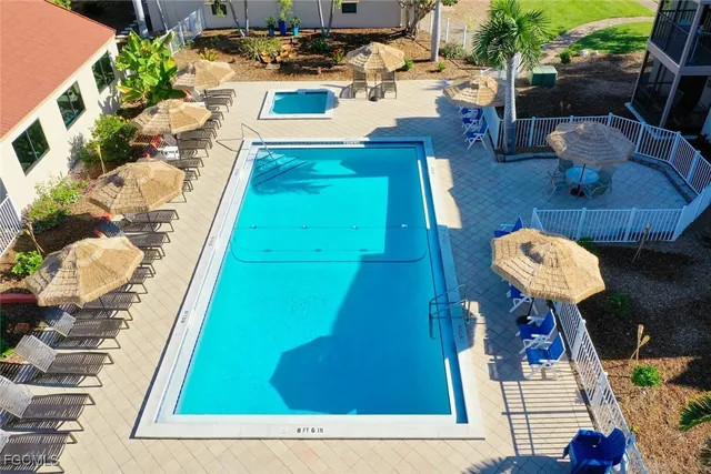 a view of a swimming pool with a patio