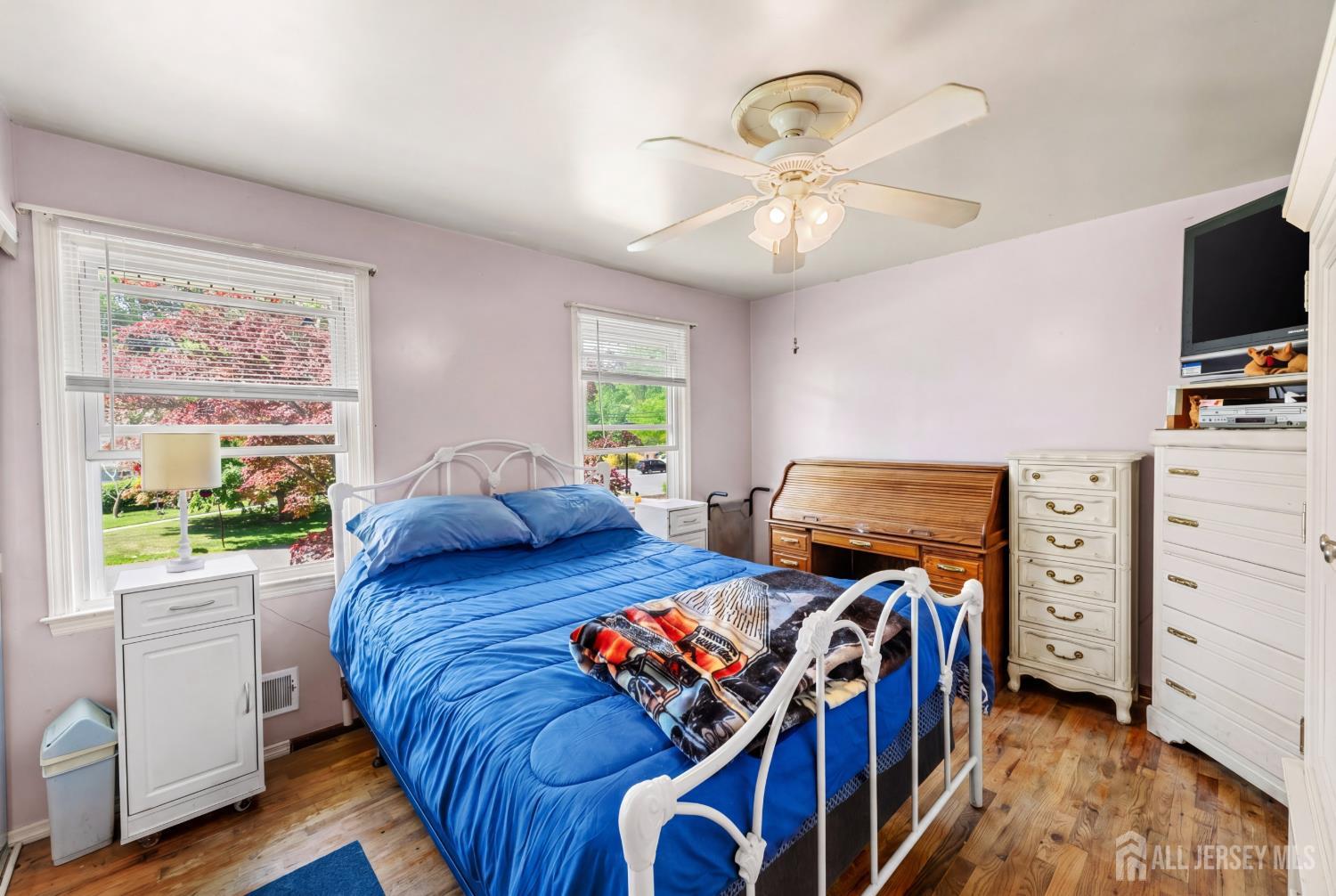 245 4th Street Dunellen, NJ 08812 - Photo 12 of 27 a bedroom with furniture and a window