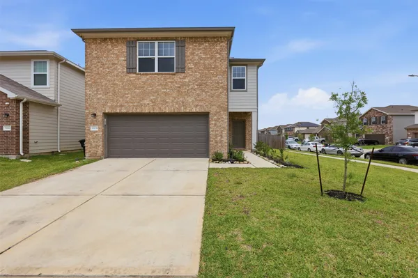 a view of house with backyard space