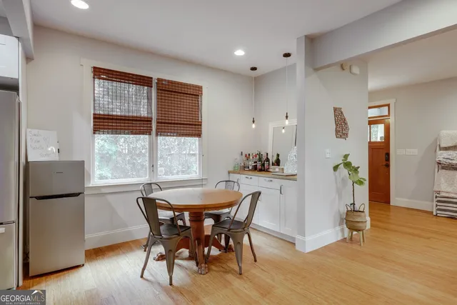 a dining room with furniture and window