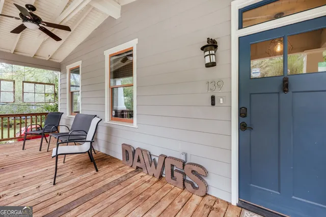 a view of a chairs and a table in the balcony