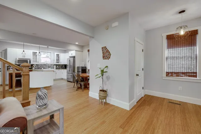 a view of a kitchen and dining room