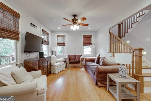 a living room with furniture and a flat screen tv