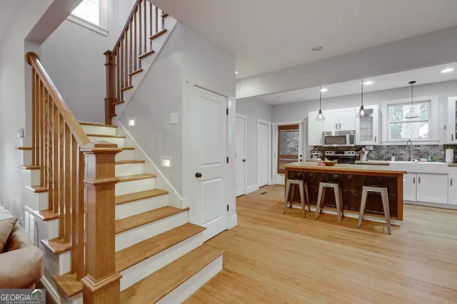 a view of kitchen with cabinets and wooden floor