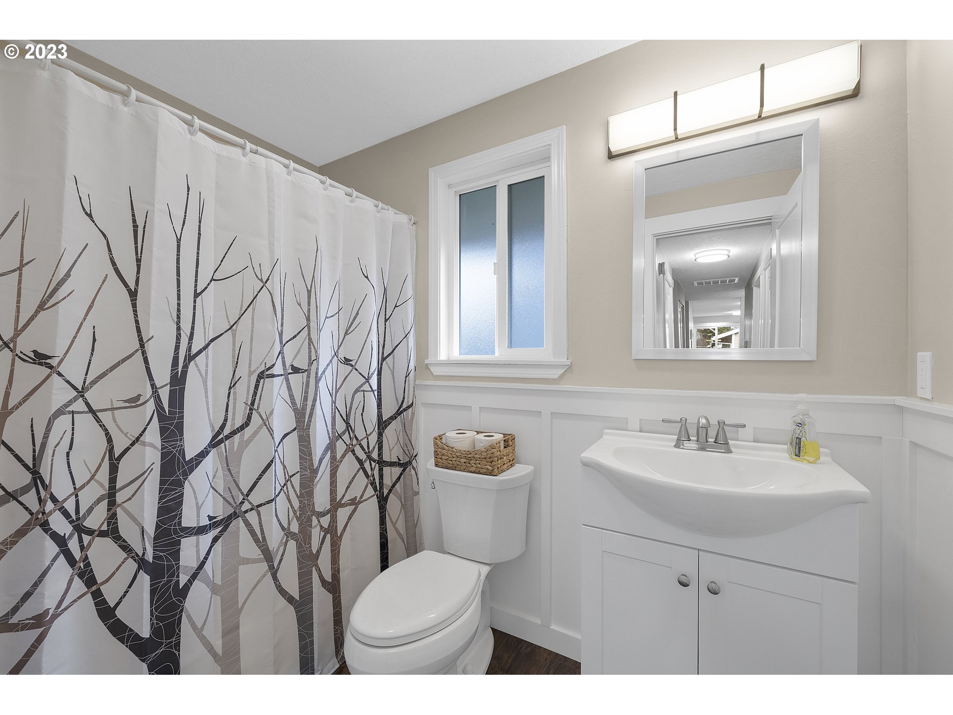 4175 Brickyard Road Tillamook, OR 97141 - Photo 10 of 20 a bathroom with a toilet sink and mirror