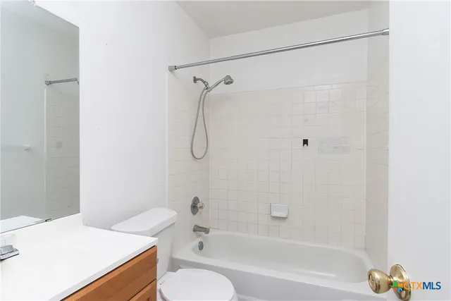 a bathroom with a sink a toilet and a bathtub