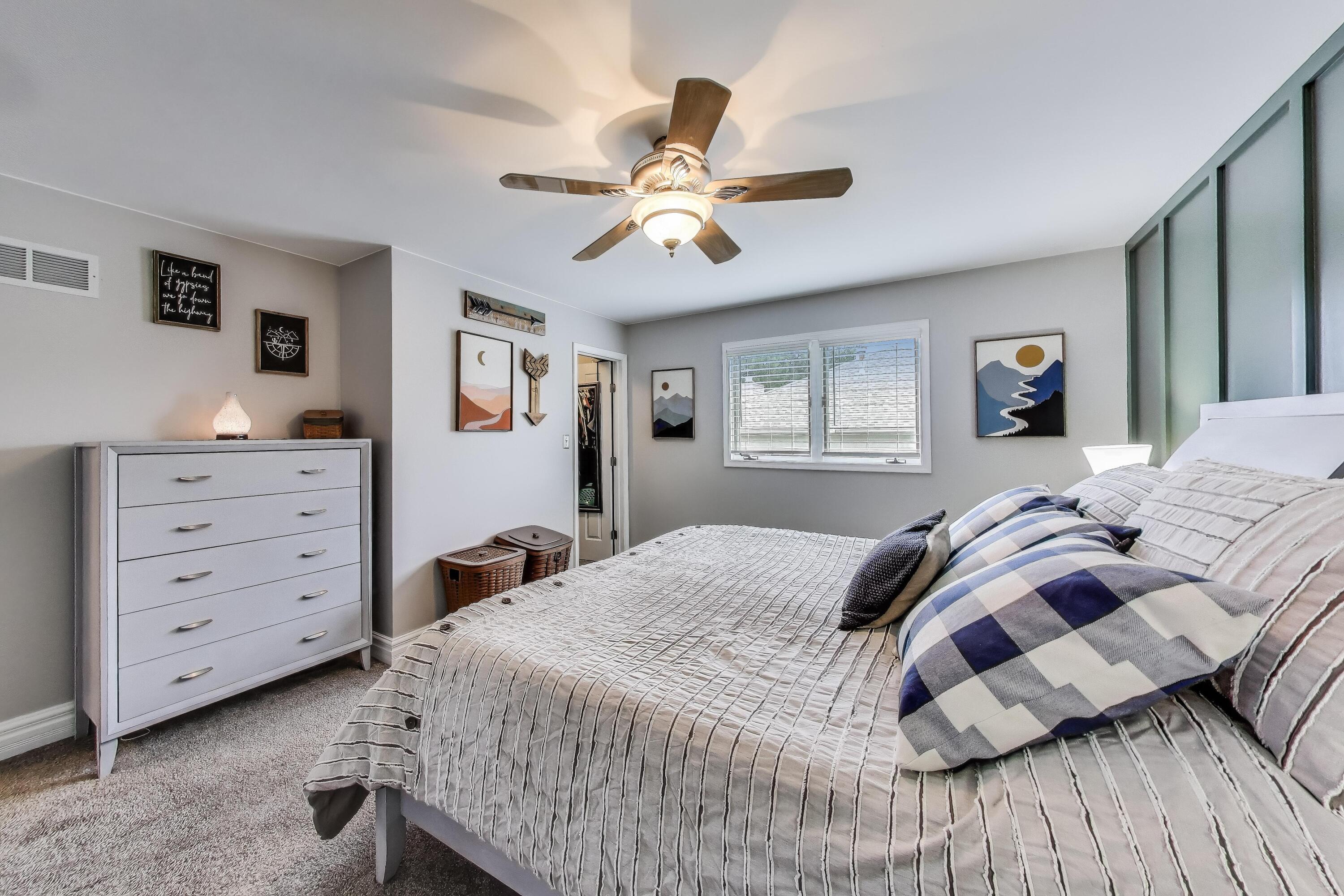 2903 Morningside Drive Crown Point, IN 46307 - Photo 12 of 39 a bedroom with a bed and a chandelier