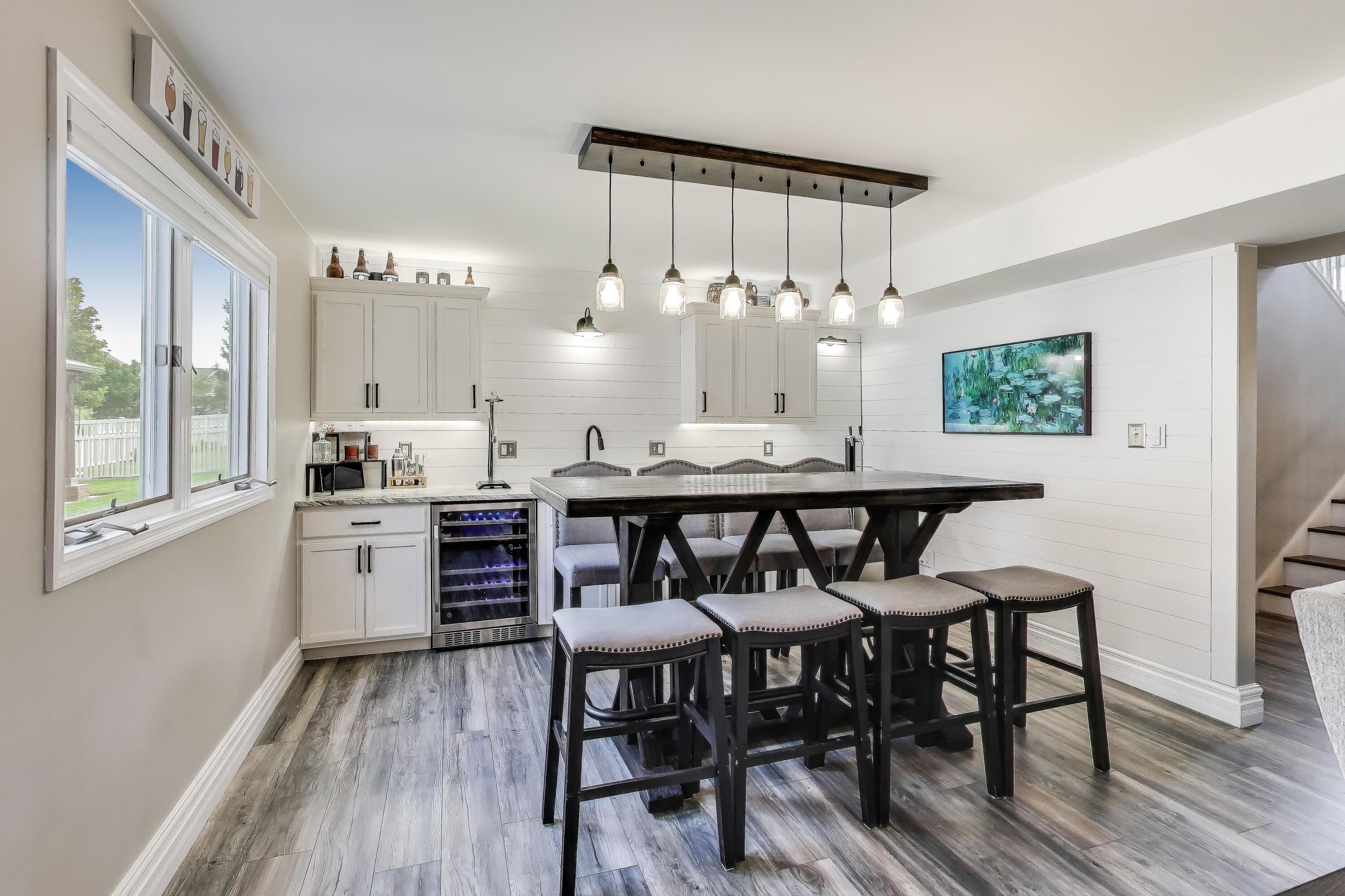 2903 Morningside Drive Crown Point, IN 46307 - Photo 23 of 39 a kitchen with furniture wooden floor dining table and stainless steel appliances