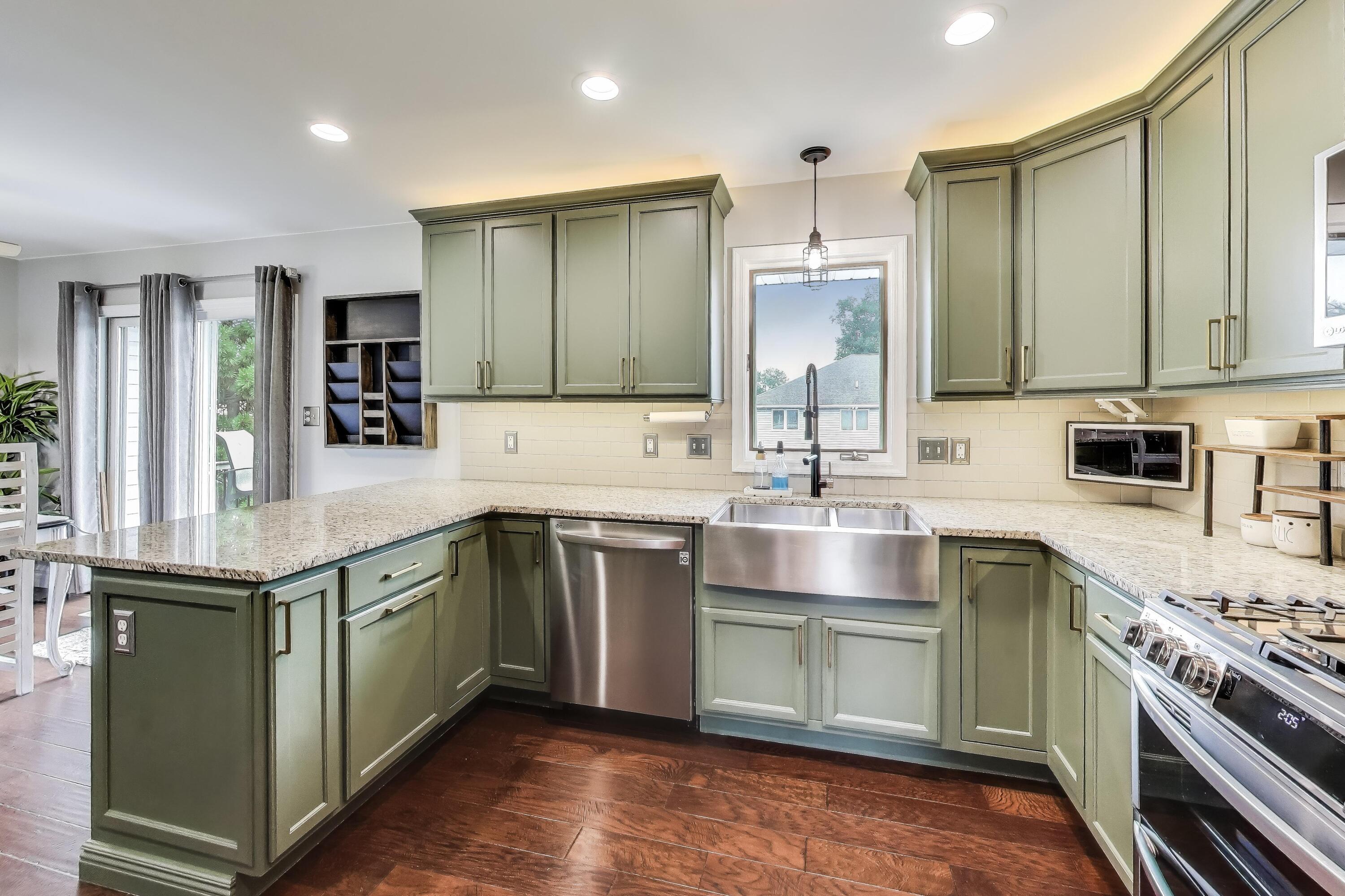 2903 Morningside Drive Crown Point, IN 46307 - Photo 9 of 39 a kitchen with kitchen island granite countertop a sink stove and cabinets
