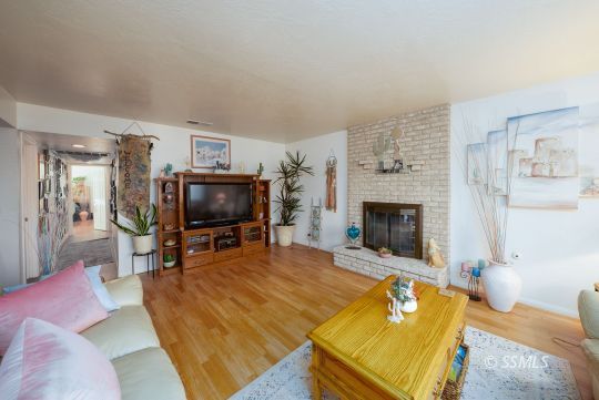820 West Ward Avenue Ridgecrest, CA 93555 - Photo 5 of 26 a living room with furniture and a flat screen tv