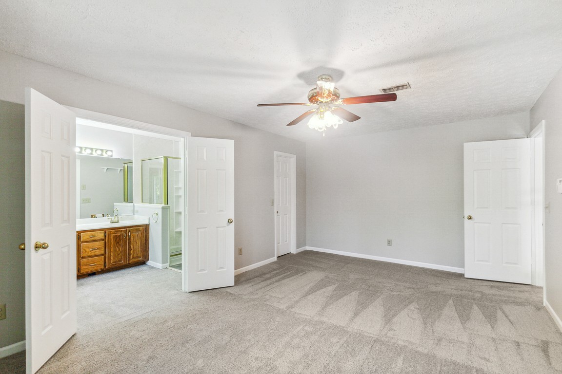 4105 New Hope Meadow Road Hermitage, TN 37076 - Photo 13 of 45 wooden floor in an empty room with a ceiling fan