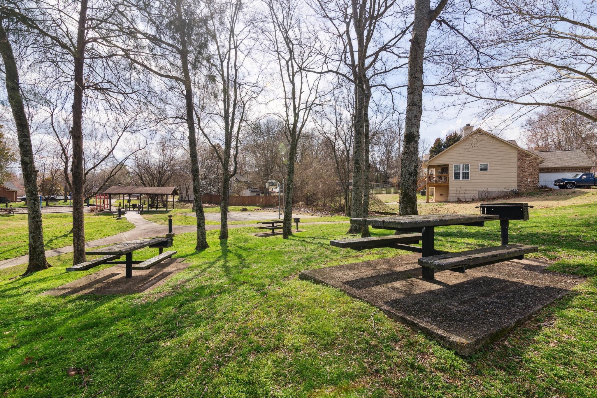 4105 New Hope Meadow Road Hermitage, TN 37076 - Photo 40 of 45 a park view with a bench and trees