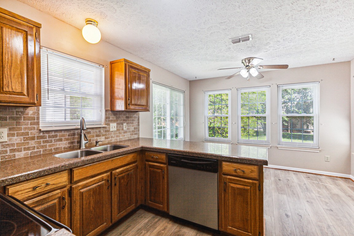 4105 New Hope Meadow Road Hermitage, TN 37076 - Photo 10 of 45 a kitchen with a sink stove and cabinets