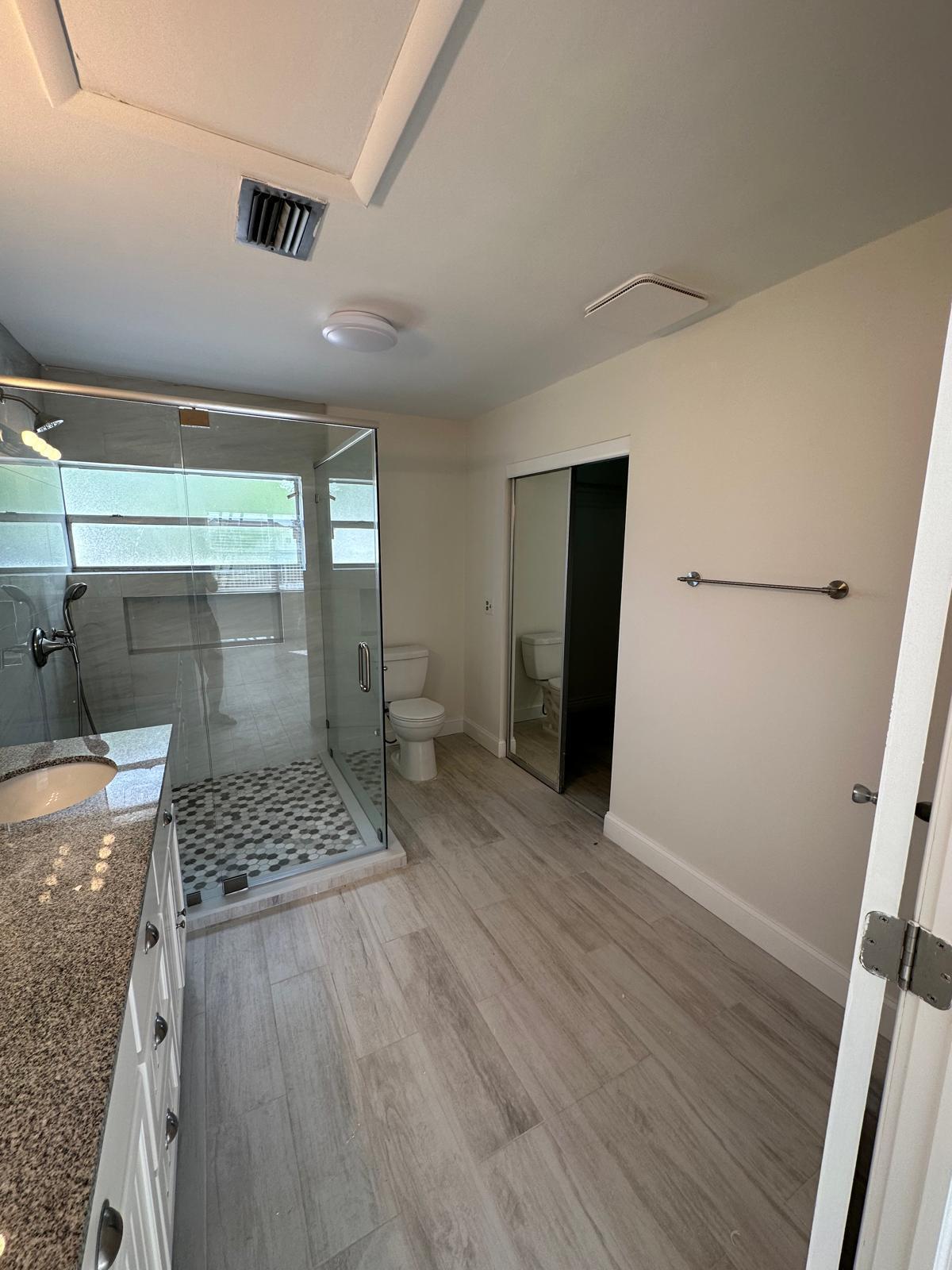 9841 Ridge Creek Road Boca Raton, FL 33496 - Photo 14 of 24 a bathroom with a sink and a mirror