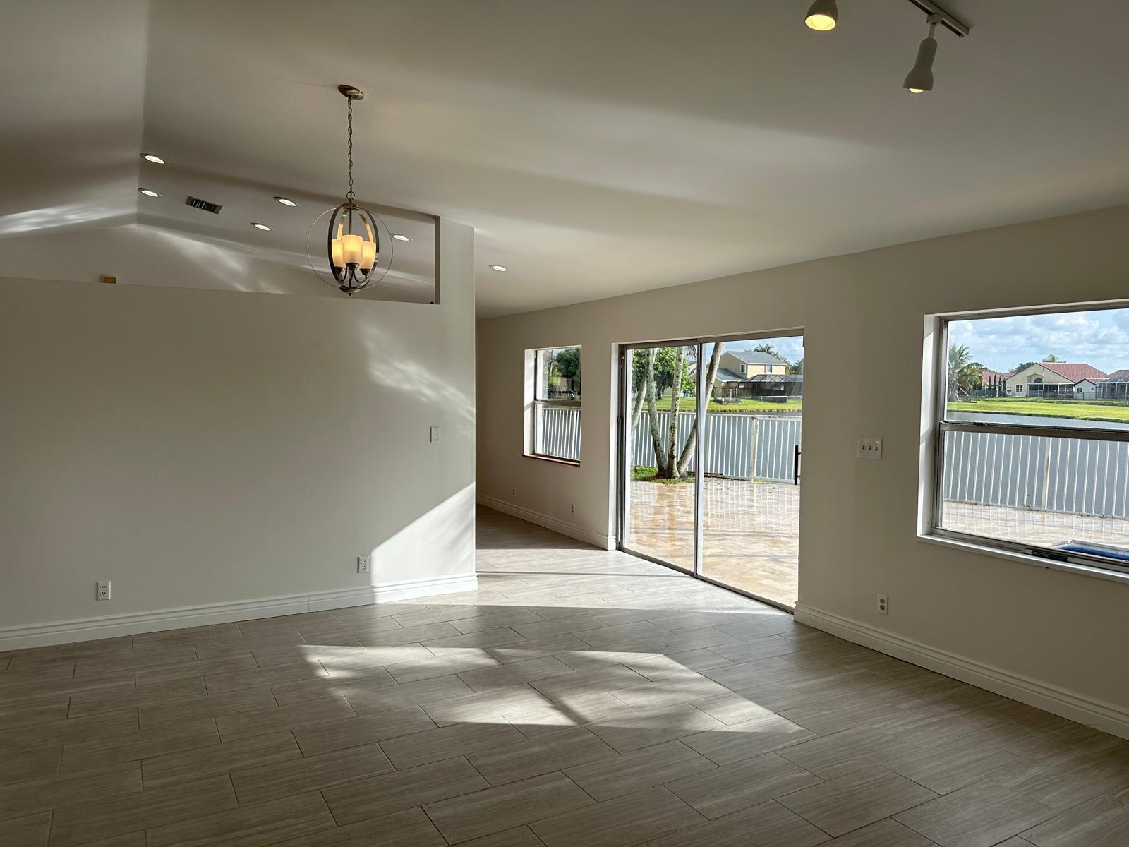 9841 Ridge Creek Road Boca Raton, FL 33496 - Photo 20 of 24 a view of an empty room with a window